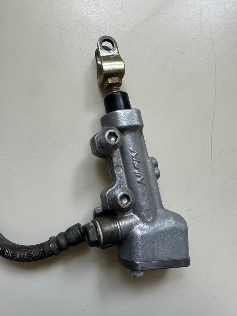 2006 KAWASAKI KX450F REAR BRAKE MASTER CYLINDER  AND CALIPER 